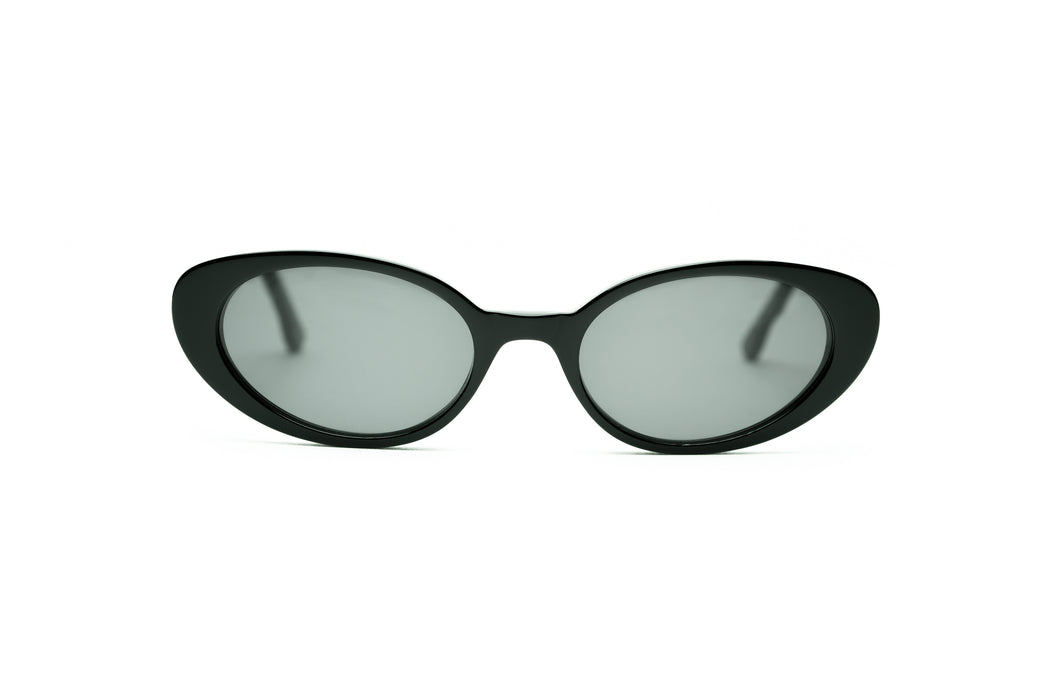 black oval sunglasses that are made in italy and inspired by midcentury fashion