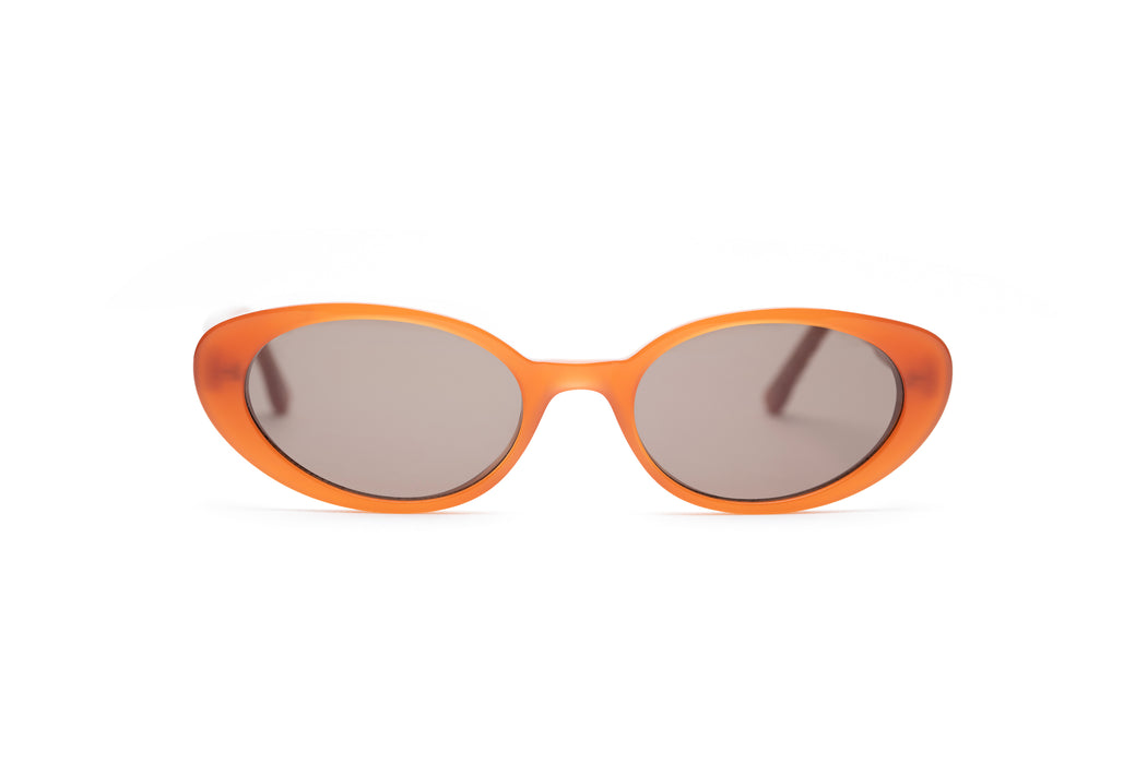 milky orange sunglasses with brown lenses that are handmade in Italy